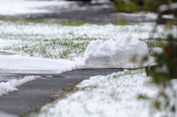 Pile of snow after winter service on a path