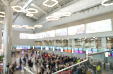 Blurred background with airport and crowd of people. Defocused picture.