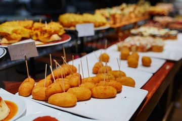 Variety of pinchos (pintxos) in a bar of San Sebastian, Spain