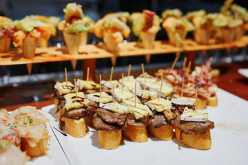 Variety of pinchos (pintxos) in a bar of San Sebastian, Spain