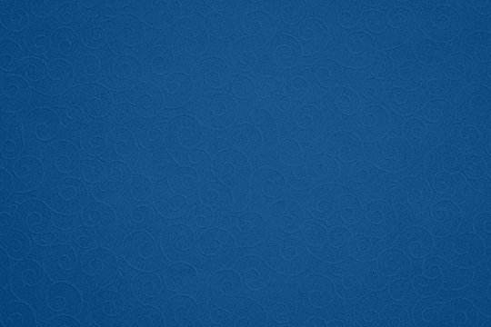 Abstract blue paper background with dark vignette. Vintage paper lace texture, copy space, text place. 2020 Color Trend classic blue pattern