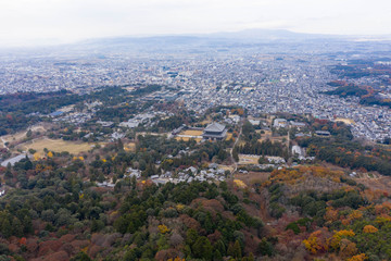 Fototapeta na wymiar Todaiji and Nara city seen from Mt Wakakusa in Autumn, Japan