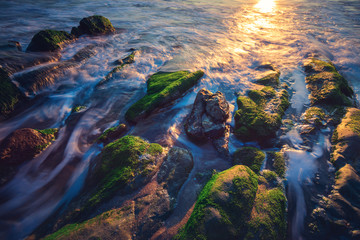 Fototapeta na wymiar Long exposure of sea and rocks