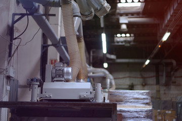 Timber Flooring Factory. Pile of cut wood in factory storage warehouse. Lumber in warehouse.