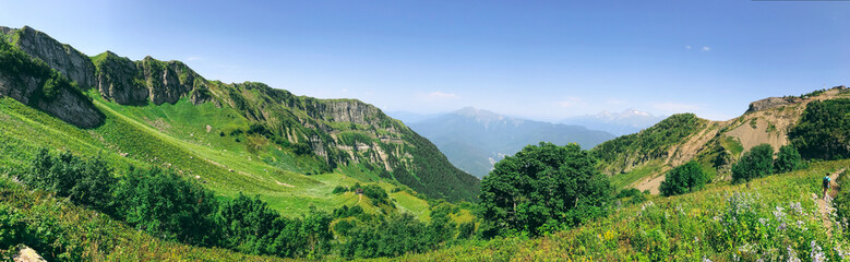 Fototapeta na wymiar Beautiful summer panorama in Caucasus mountains. Roza Khutor, Russia