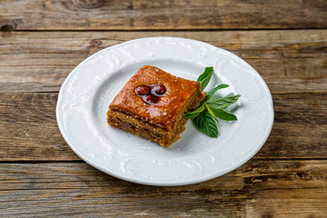 Traditional arabic dessert Baklava on wooden table