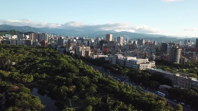 Forest Park Oasis in Middle of Urban Asian Metropolis, Taipei Taiwan, Aerial View of Daan Park and Neighborhood on Sunset Sunlight