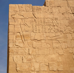Karnak Temple, complex of Amun-Re. Embossed hieroglyphics on walls. Luxor Governorate, Egypt.