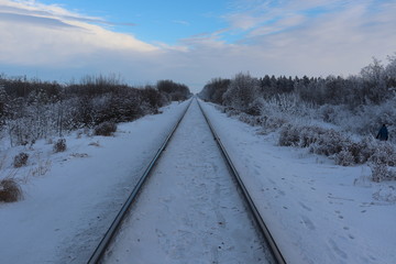 A view down train tracks in winter