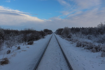 A view down train tracks in winter