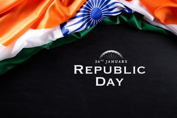 Indian republic day concept. Indian flag with the text Happy republic day against a blackboard background. 26 January.
