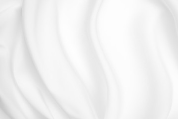 Obraz premium Abstract white fabric texture background. Cloth soft wave. Creases of satin, silk, and cotton.