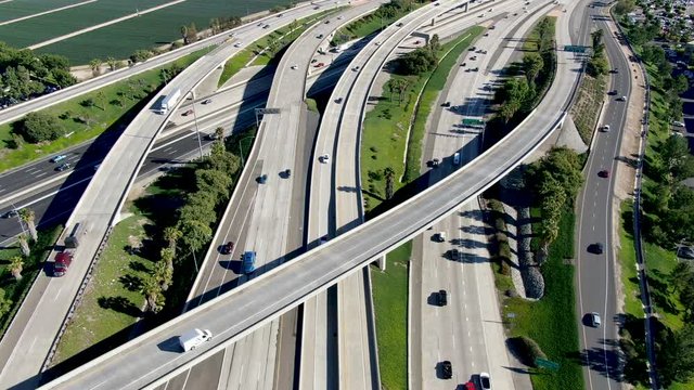 Aerial view of highway transportation with small traffic, highway interchange and junction, San Diego Freeway and Santa Ana Freeway. USU California