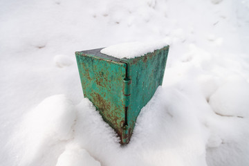 Snow covered metal box for electrical equipment