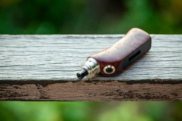 high end rebuildable dripping atomizer with stabilized natural redwood burl regulated box mods on...