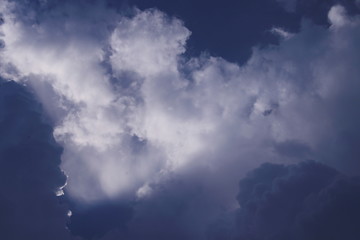 Dark blue sky and group white cloud with light.