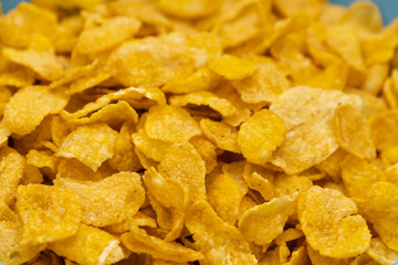 Golden cornflakes in the bowl texture patterns for background design