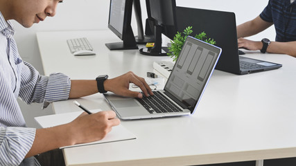 Cropped shot of young programmer team while they are working/giving a concentrate on work in the...