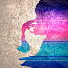 Face front view. Elegant silhouette of a female head. Portrait of a happy smiled woman. Gradient paint horizontal lines
