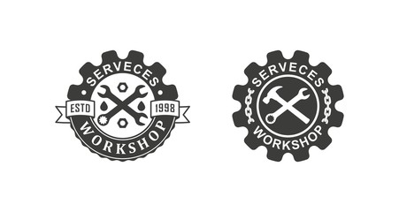 Black and white illustration set of workshop logos on a white background. Vector illustration of a wrench, gear, chain and text with ribbons