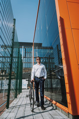 Happy young man with bicycle stock photo