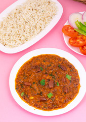 Rajma Chawal or Rajma Jeera Chawal (Rice) is a Traditional North Indian Food, Consisting of Cooked Red Kidney Beans in a Thick Gravy with Spices. Served with Jeera Rice