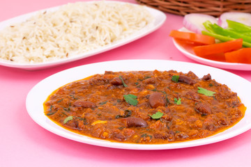Rajma Chawal or Rajma Jeera Chawal (Rice) is a Traditional North Indian Food, Consisting of Cooked Red Kidney Beans in a Thick Gravy with Spices. Served with Jeera Rice