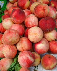 Fototapeta na wymiar Sweet red ripe peaches at the rural market