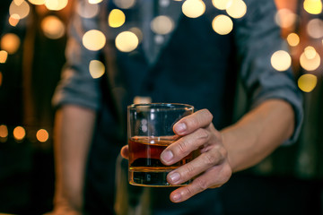 Whisky is poured into glass Beautiful bokeh