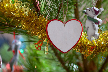 Red white heart on pine tree