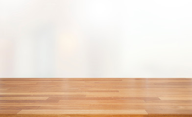Empty wooden table and white interior background
