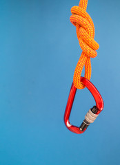 Carabiner and knot from a climbing rope.