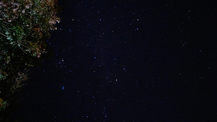 Time lapse of galaxies and meteor at night