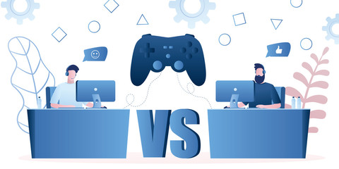 Two professional gamers and big game controller.Guys with headsets at the table at computer playing video games.