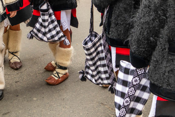 Sighetu Marmatiei, Romania: Maramures traditional costumes. Traditional Romanian peasant sandals which is worn with the Romanian peasant costume at Winter Customs and Traditions Marmatia Festival