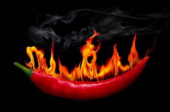 On Fire Red Chili Pepper At Black Background