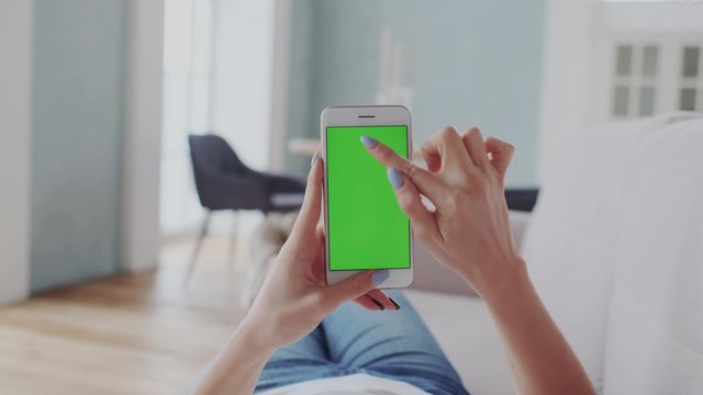 Chromakey Tracking or Green Screen. Adult Girl Touches Smartphone. Using Interactive Mobile Apps. Click buttons of modern Mobile Aplication, Interacting with Touchpad menu.