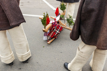 Sighetu Marmatiei, Romania: Maramures traditional costumes. Traditional Romanian peasant sandals which is worn with the Romanian peasant costume at Winter Customs and Traditions Marmatia Festival