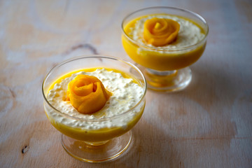 Sweet tapioca pudding with coconut milk and fresh mango flowers