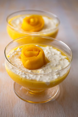 Sweet tapioca pudding with coconut milk and fresh mango flowers