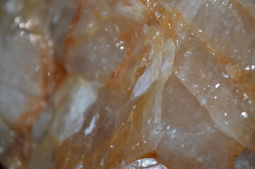 The surface of the stone looks like a glass that is colored and illuminated.