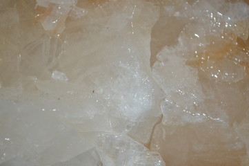 The surface of the stone looks like a glass that is colored and illuminated.