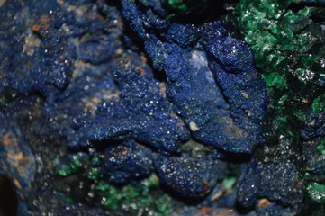 The surface of the stone looks like a glass that is colored and illuminated.