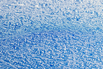 Blue snowy surface.