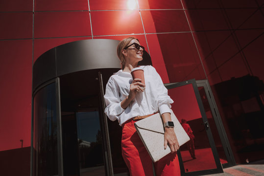Beautiful smiling lady standing on the street