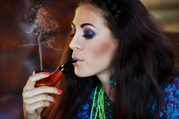Cuban woman smoking. Beautiful brunette woman.