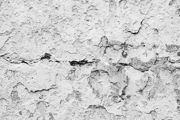 Texture of a concrete wall with cracks and scratches which can be used as a background