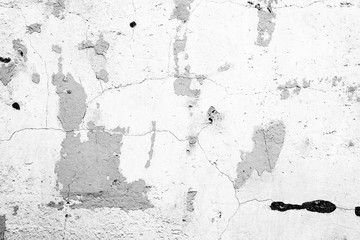 Texture of a concrete wall with cracks and scratches which can be used as a background