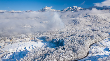Japanese countryside covered with snow and clouds A