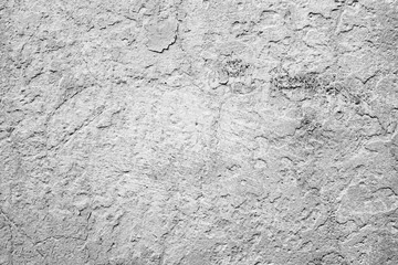 Texture of a concrete wall with cracks and scratches which can be used as a background